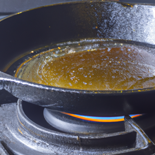 A cast iron skillet being seasoned with vegetable oil